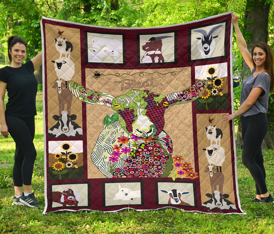 Baby goat on farm quilt