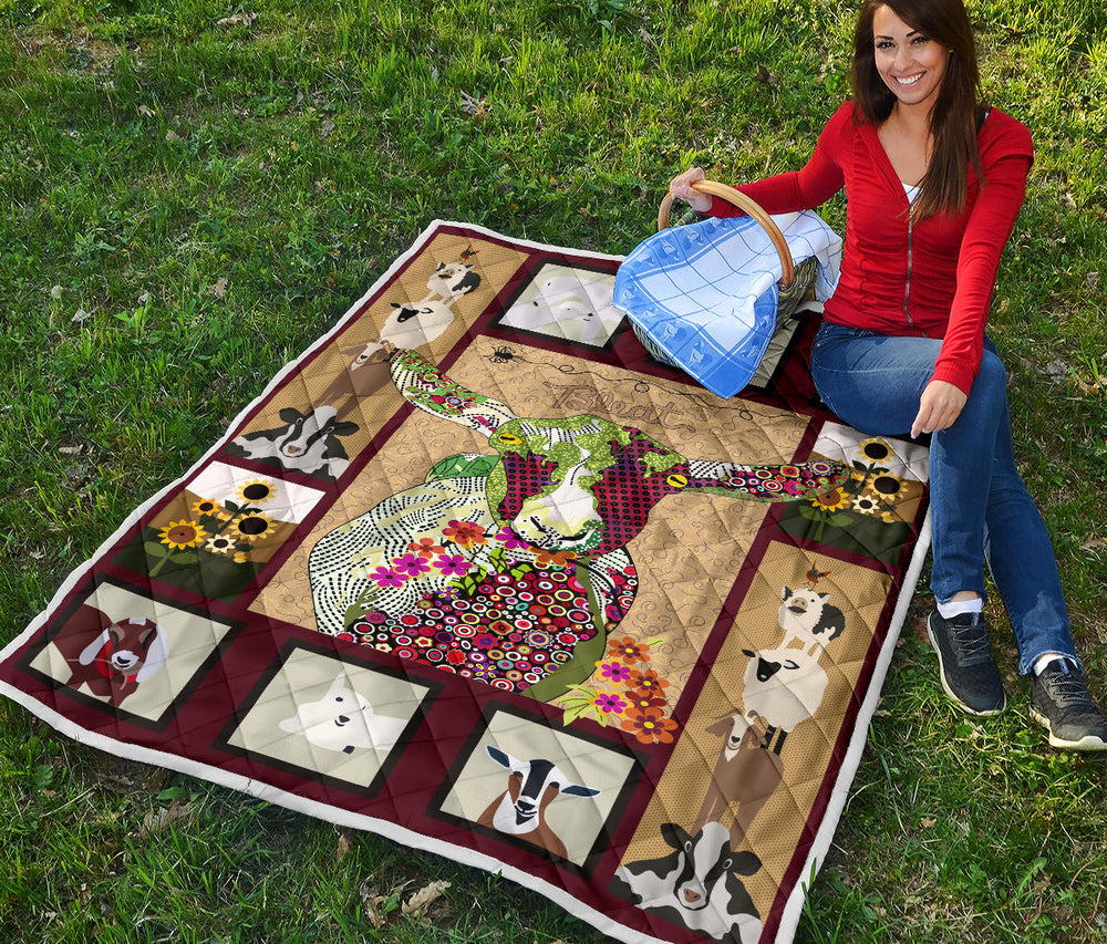 Baby goat on farm quilt